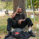 An unhoused man who asked to not be named tries to stay cool near a misting station in Lents Park during an extreme heat wave on Aug. 13, 2021 in Portland, Oregon.